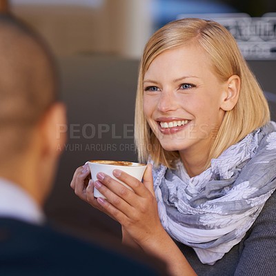 Buy stock photo Woman, relax and smile in morning with coffee for start of day, together with friend and talking in cafe for catchup before work. Female person, calm and happy with cup expresso with discussion