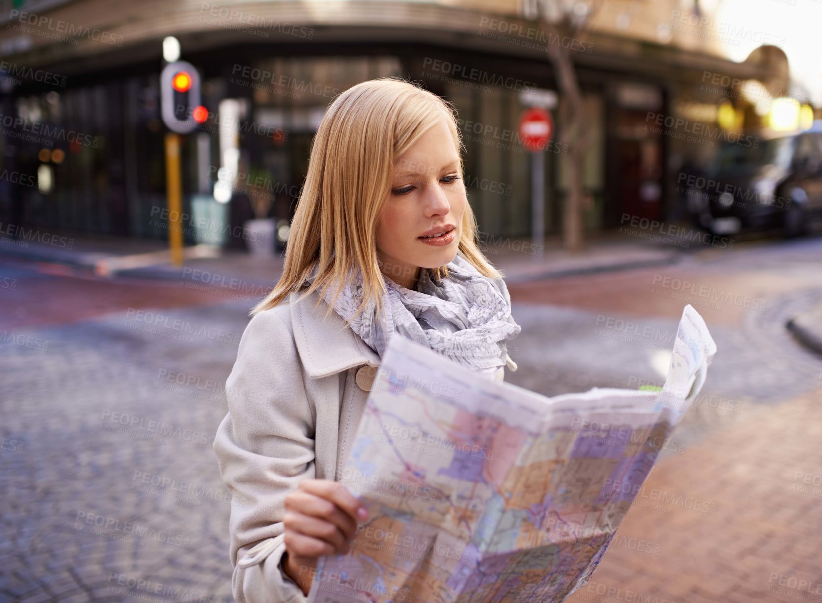 Buy stock photo Woman, tourist and reading a map in city street for directions, travel or journey in Cape Town. German female, confused and holding a navigation chart in urban background on vacation, holiday or lost