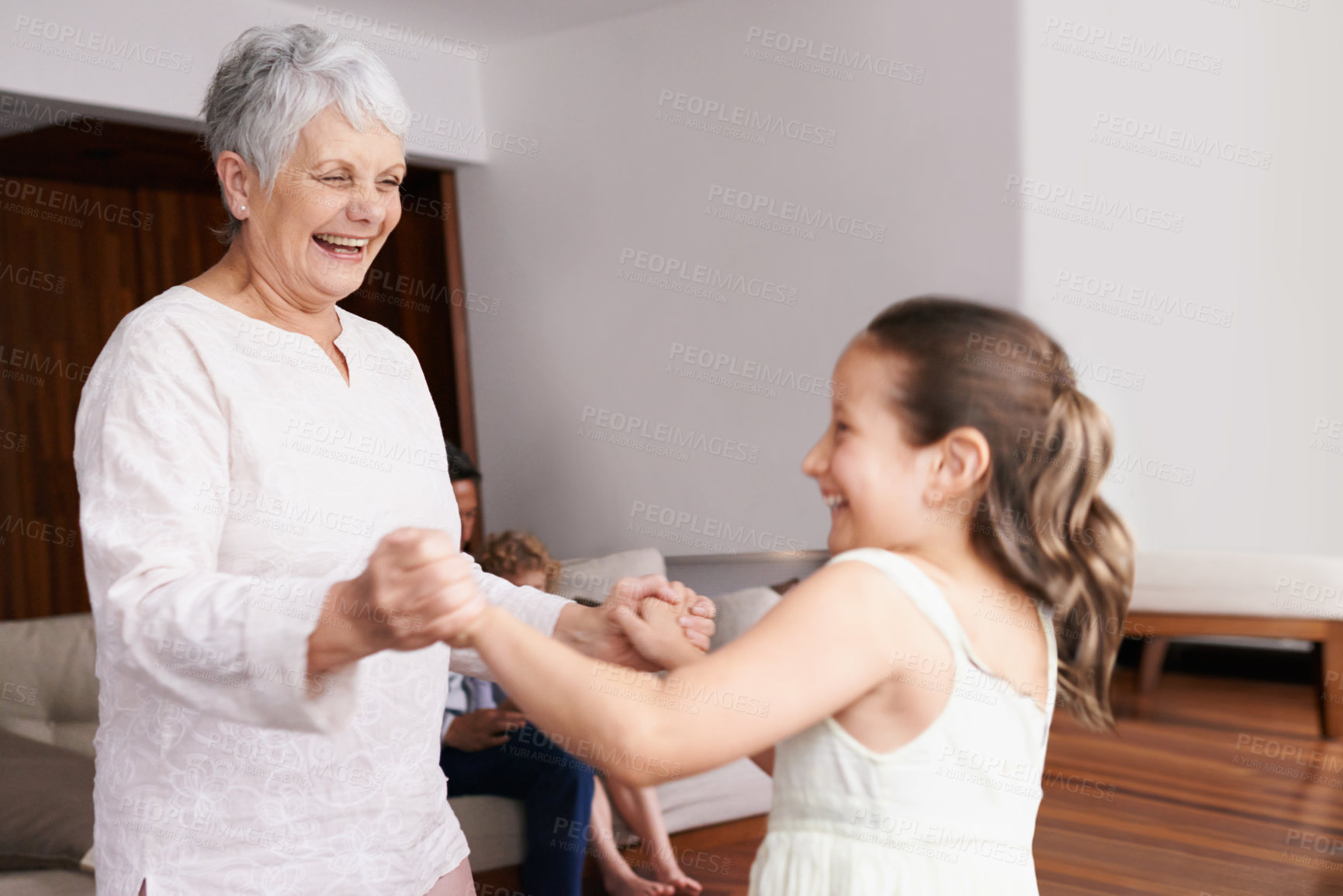 Buy stock photo Holding hands, dance or happy grandmother with a child playing or laughing with joy in family home. Grandma dancing, kid smiling or funny old woman relaxing or bonding together in retirement or house
