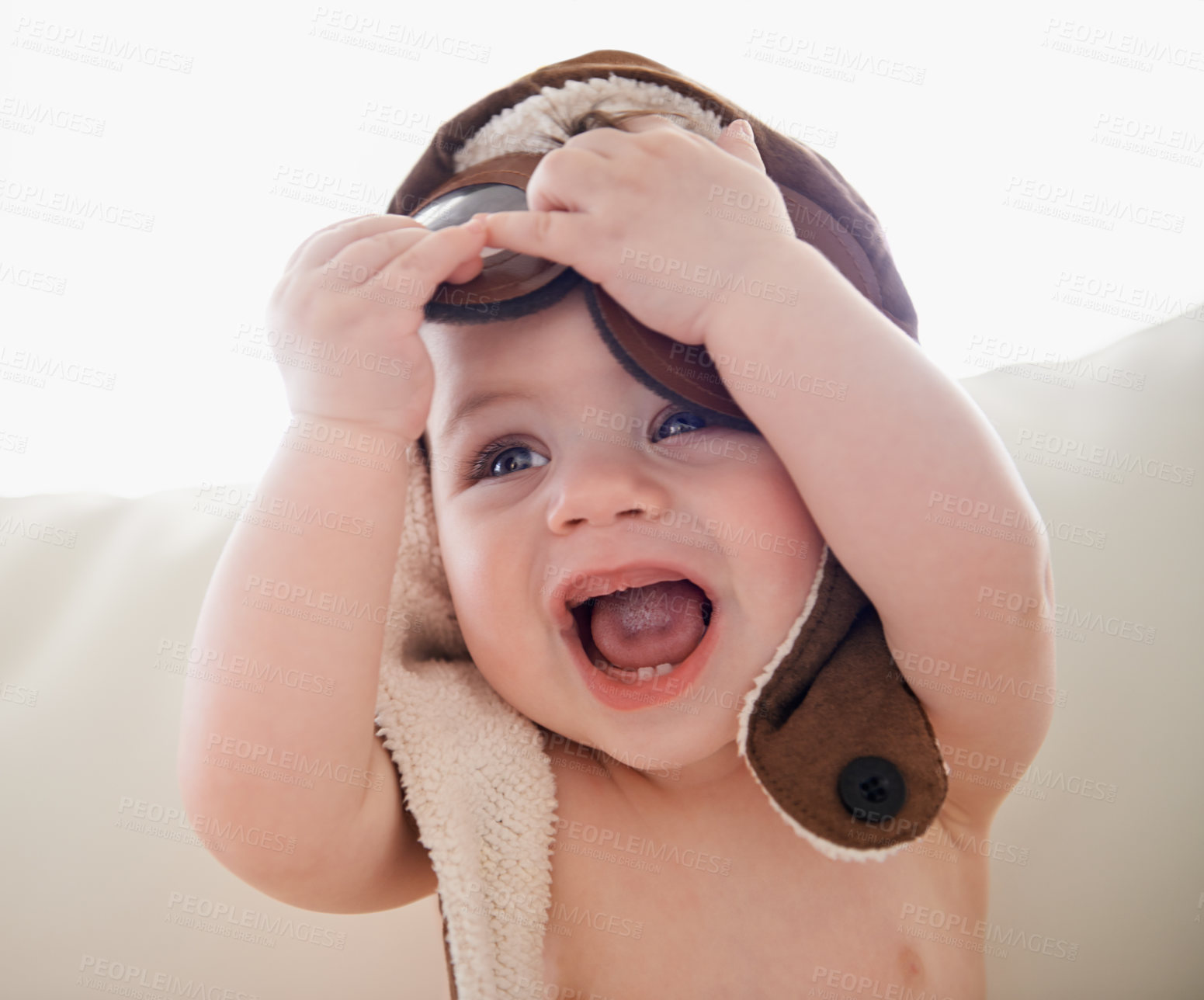 Buy stock photo Baby, hat and happy playing or home with laughing for childhood development with curiosity, costume or growing. Kid, accessories and joy in apartment on sofa in Canada or weekend, innocent or cute