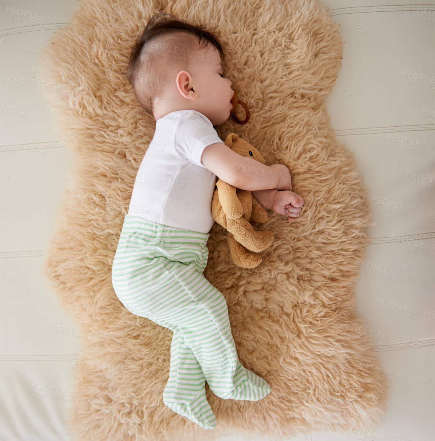 Buy stock photo Baby, sleeping and dummy with relax in home for healthy development, growth and tired with top view. Child, rest and pacifier in mouth with nap, dreaming and wellness in nursery of house or apartment
