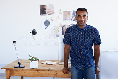 Buy stock photo Man, portrait and desk at creative studio or startup as 
graphic designer with photographs, project planning or magazine. Male person, face and confidence or small business, entrepreneur or workspace