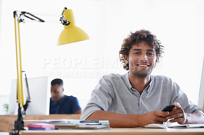 Buy stock photo Creative, coworking space and portrait of man with phone at desk for networking on project in happy office. Relax, smile or professional designer with smartphone, research and architecture business.