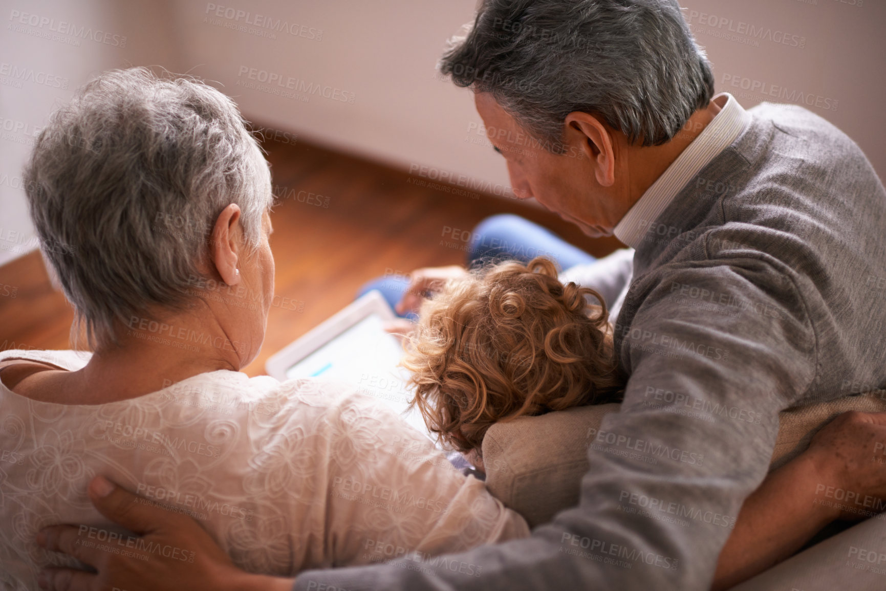 Buy stock photo Child, grandparents and tablet on couch for online technology or communication, teaching or connection. Elderly couple, retirement and girl or internet learning in apartment, development or bonding