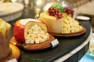 Buy stock photo Food, cheese and fruit in restaurant display for catering service, buffet selection and banquet for eating. Cafeteria, fine dining and closeup of table for lunch, supper and dinner event for wellness