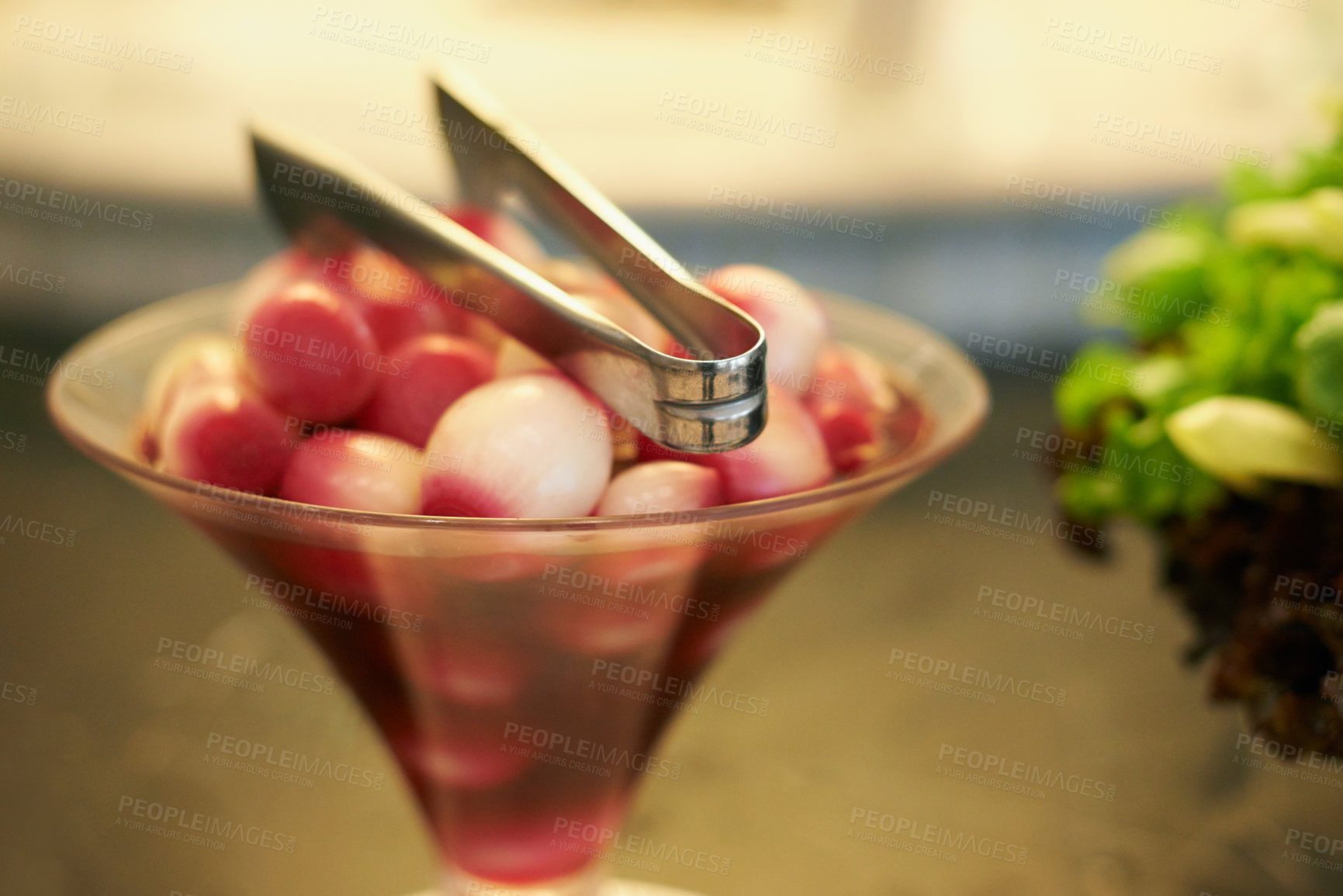 Buy stock photo Olives arranged in a glass with tongs