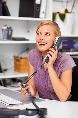 Buy stock photo Happy secretary, woman and landline telephone with listening, deal or contact with excited face in office. Receptionist, person and employee with smile for phone call with news, story or info at job