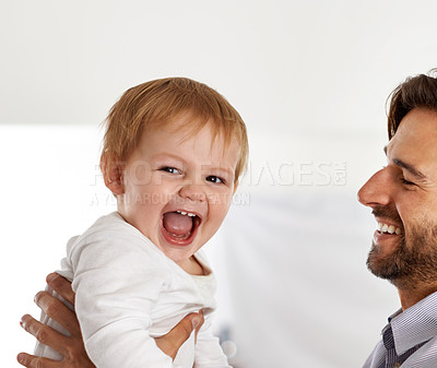Buy stock photo Father, baby and excited portrait with play in home for healthy development, parenting and bonding on weekend. Family, child and man with face, laughing and lifting for relax, love and care in house 
