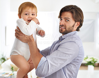 Buy stock photo Baby boy, father and portrait with disgusted face, foul smell and dirty diaper to change. Male toddler, dad and people at home, living room or house for parenthood, child development and hygiene