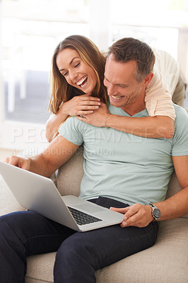 Buy stock photo Computer, laugh and happy couple on sofa with online men, website review or reading post on social media together.  Funny, home and hug of mature partner, woman or people on laptop and smile for meme