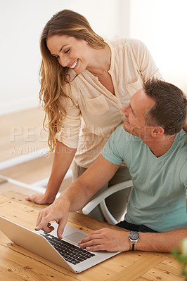 Buy stock photo Computer, pointing and happy couple on home internet for online planning, website and to check application together. Support, talking and woman, partner or people with choice or reading on laptop