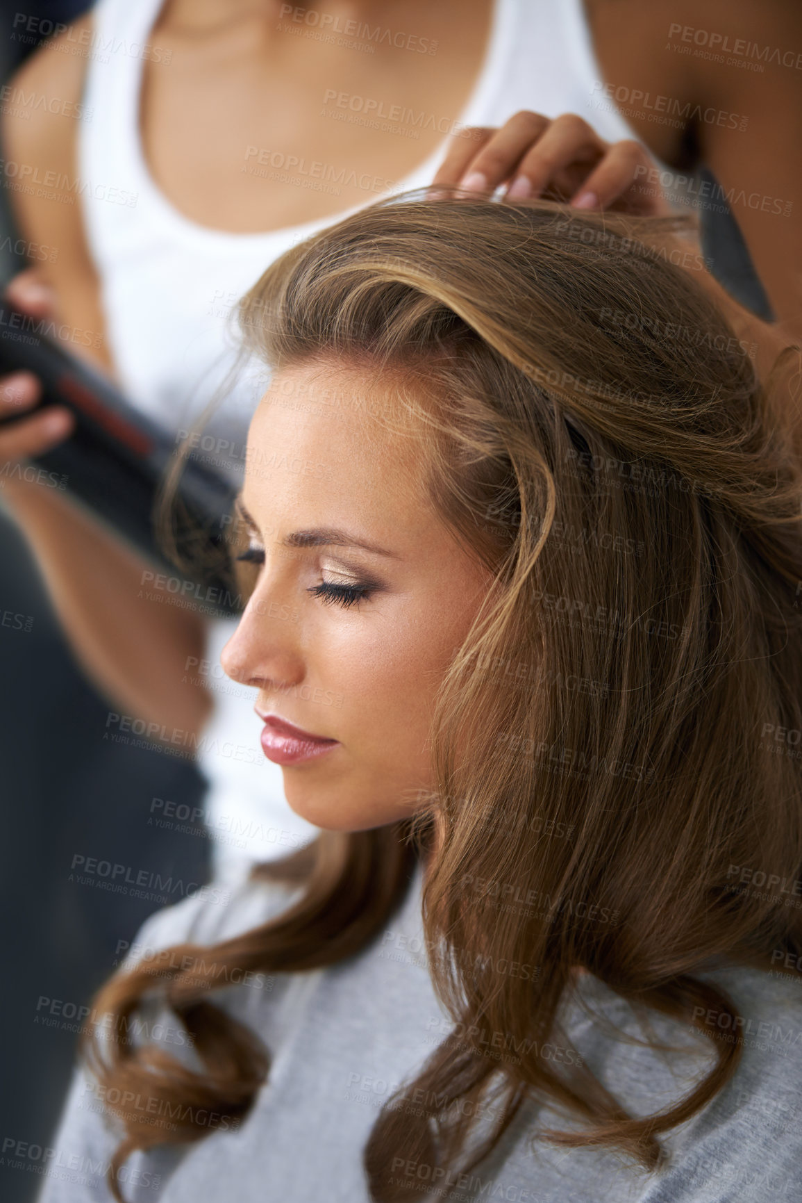 Buy stock photo A beautiful young woman spending the day getting her hair and makeup done