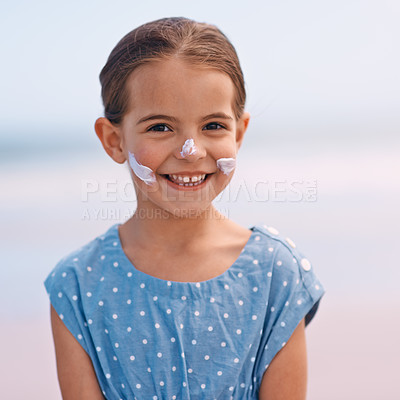 Buy stock photo Little girl, portrait and outdoors with sunscreen, smile and cheerful on holiday vacation. Young daughter, happy and cute confidence for getaway, fun and sunblock for protection and summertime
