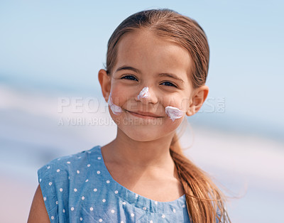 Buy stock photo Child, portrait and smile with sunscreen on beach or summer protection or travel adventure, safety or holiday. Female person, girl and face or skincare lotion in Australia for vacation, break or trip