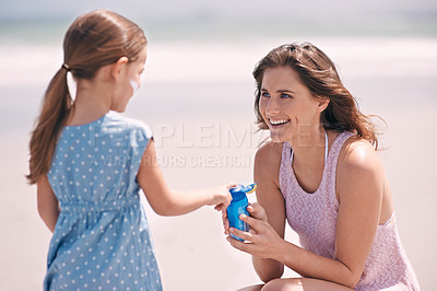 Buy stock photo Happy mother, girl and sunscreen bottle at beach for summer holiday, vacation or travel. Child, kid and mom apply sunblock cream outdoor for protection, health or skincare of family laughing together
