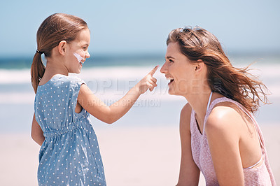Buy stock photo Child, mother and nose with sunscreen on beach for summer protection for healthy skin, safety or weekend. Woman, daughter and happy in Florida for bonding holiday or vacation, sunshine or outdoor