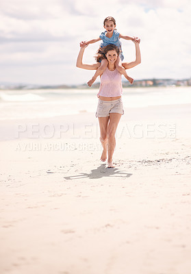 Buy stock photo Happy mother, piggyback and playing with child on beach for summer holiday weekend or vacation in nature. Portrait of mom with daughter on shoulders for walk or bonding by ocean coast on mockup space
