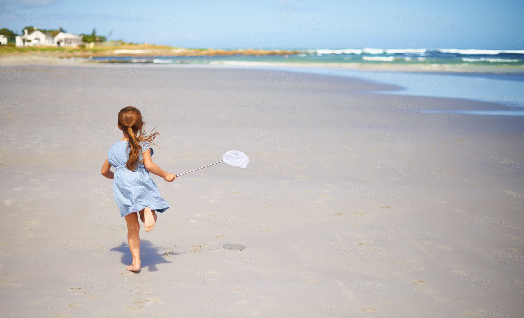 Buy stock photo Child, beach and running with fishing net or nature explore in summer or vacation adventure, environment or rear view. Female person, kid and seaside in Florida for holiday destination, ocean or trip