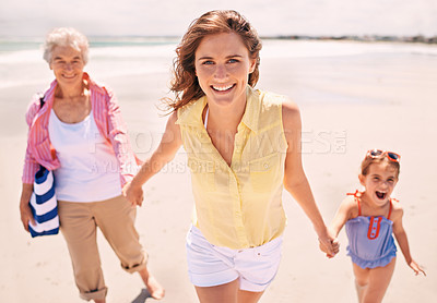Buy stock photo Portrait, smile and family holding hands on beach for walking in summer on travel, vacation or holiday. Grandma, mother and daughter outdoor together on sand by sea or ocean for love and bonding