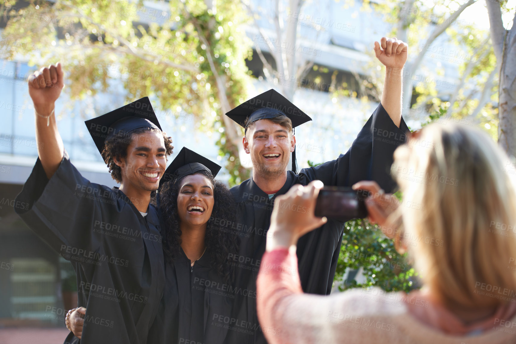Buy stock photo Graduation, university and students smile for picture for learning, studying and knowledge on campus. Education, friends and man and woman with phone for celebration, graduate ceremony and college