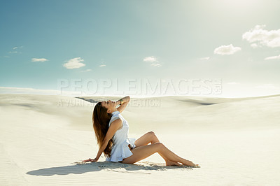 Buy stock photo girl sitting in the desert