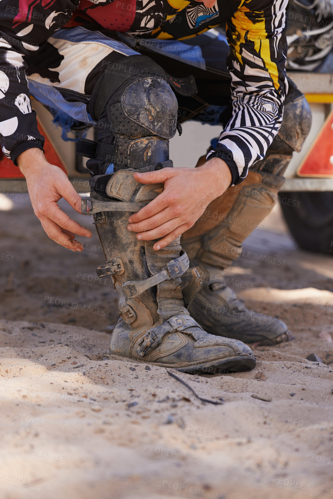 Buy stock photo Hands, boots and motorbike with person getting ready for competition, race or training closeup. Exercise, fitness and sports with athlete outdoor in preparation of off road action or performance