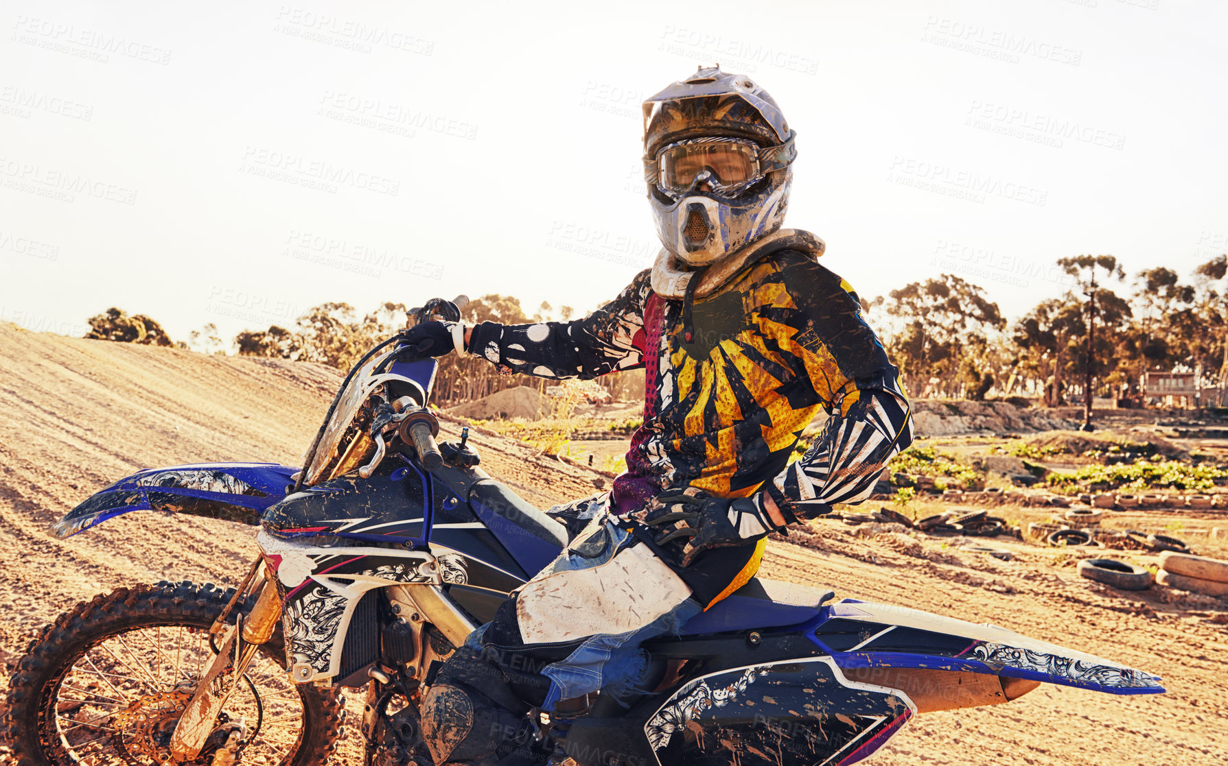 Buy stock photo Helmet, race and man on dirt bike in desert with adventure, adrenaline or speed in competition, Extreme sport, trick and athlete on off road motorcycle for challenge, power or danger on action course