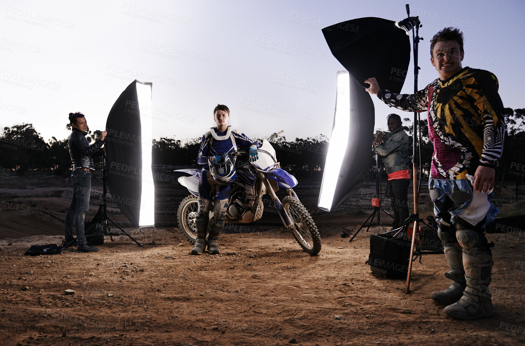 Buy stock photo Photoshoot, motorcycle and person in nature with lighting, equipment and tools for creative project. Gear, group of people and helmet for extreme sport production and photography on off road track.