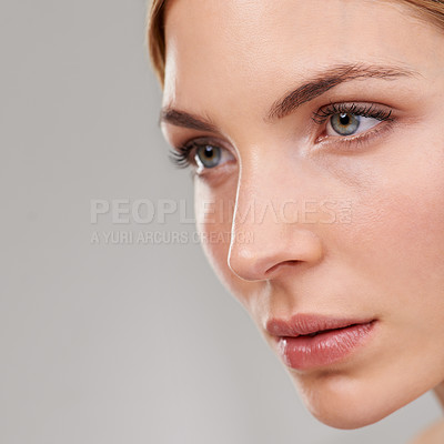 Buy stock photo Beauty, cosmetics and face of woman with skincare, natural glow and anti aging facial in studio mockup. Dermatology, healthy skin and girl on grey background with luxury care, thinking and wellness