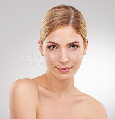 Buy stock photo Beauty, skincare and portrait of woman with facial glow, confidence and cosmetics in studio. Dermatology, healthy skin and serious face of girl on white background with luxury, care and wellness.