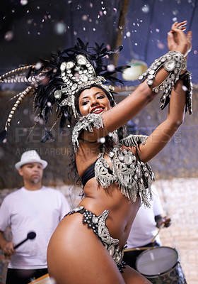 Buy stock photo Dancer, carnival and girl in performance with band, feather crown and pride for culture in low angle in night. Person, woman and stage at event, party and music for celebration in Rio de Janeiro