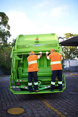 Buy stock photo Cropped shot of a garbage collection team at work