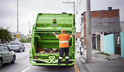 Buy stock photo Cropped shot of a busy garbage collection worker