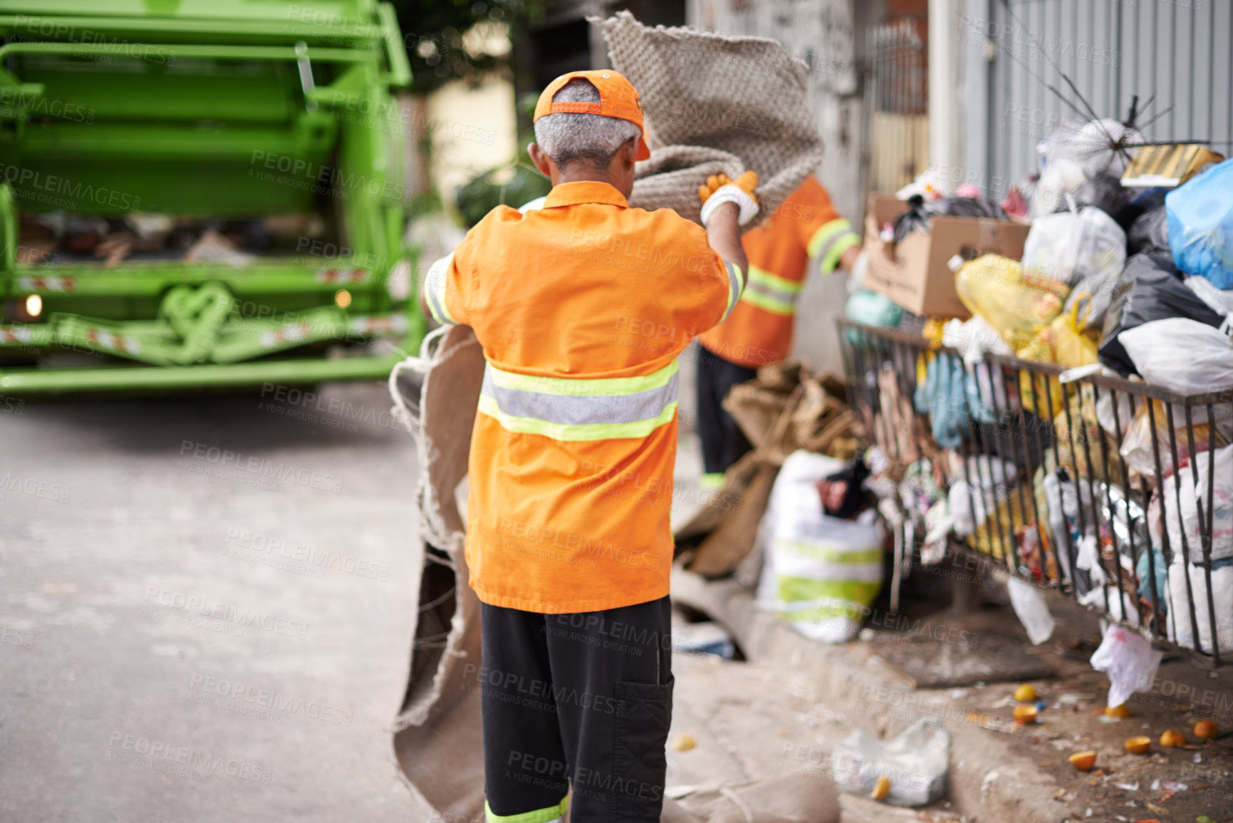 Buy stock photo Man, garbage truck and trash collection on street for waste management in city for recycling plastic, junk or sanitation. Male person, uniform and dirt transportation in New York, pollution or mess