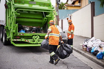 Buy stock photo Cropped shot of a garbage collection team at work