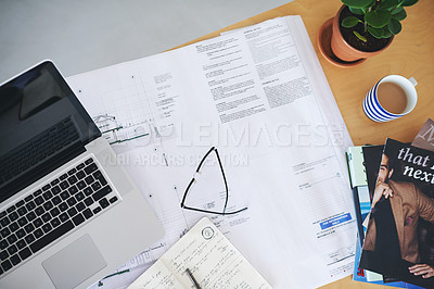 Buy stock photo Notebook, laptop and blueprint on office desk above for architecture planning, strategy or layout. Top view of building paperwork, floor plan or architect notes for construction ideas on workspace