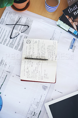 Buy stock photo Notebook, blueprint and writing on office desk above for architecture planning, strategy or layout. Top view of building paperwork, floor plan or architect notes for construction, ideas or design