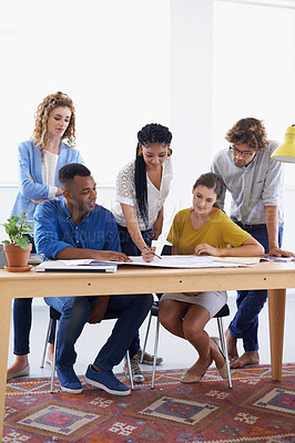 Buy stock photo Diversity, business people and blueprint in meeting for planning, construction or strategy at the office. Architect group working together on document in collaboration for floor plan at the workplace