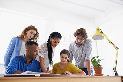 Buy stock photo Diversity, business people and documents in planning, brainstorming or design strategy at the office. Group of diverse employees working together on paperwork in teamwork collaboration at workplace