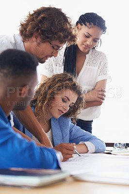 Buy stock photo Business people, writing and planning on project for collaboration, strategy or ideas at office. Group of employees with documents or paperwork in meeting or teamwork for brainstorming at workplace