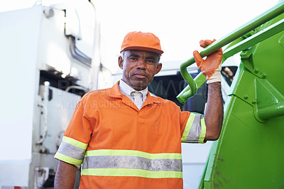 Buy stock photo Cropped shot of a male worker on garbage day