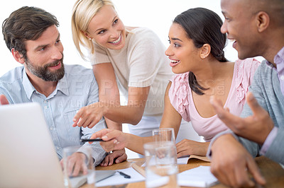 Buy stock photo Shot of a group of business people in the middle of a discussion