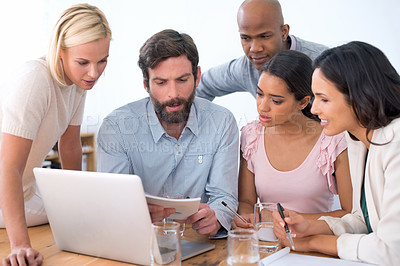Buy stock photo Group, notebook and business people in discussion, planning or brainstorming ideas in startup. Teamwork, laptop and serious employees in collaboration, diversity and creative copywriter in meeting