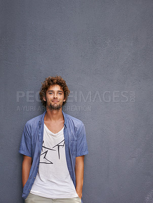 Buy stock photo Fashion, confidence and portrait of a man by a wall with mockup space with a casual, cool and stylish outfit. Happy, positive and handsome male model with trendy style by gray background with mock up