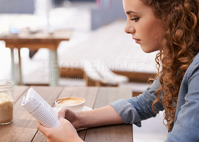 Buy stock photo Reading, coffee and woman with book in restaurant in morning with literature novel for knowledge. Diner, calm and young female person enjoying story and drinking cappuccino, latte or espresso in cafe
