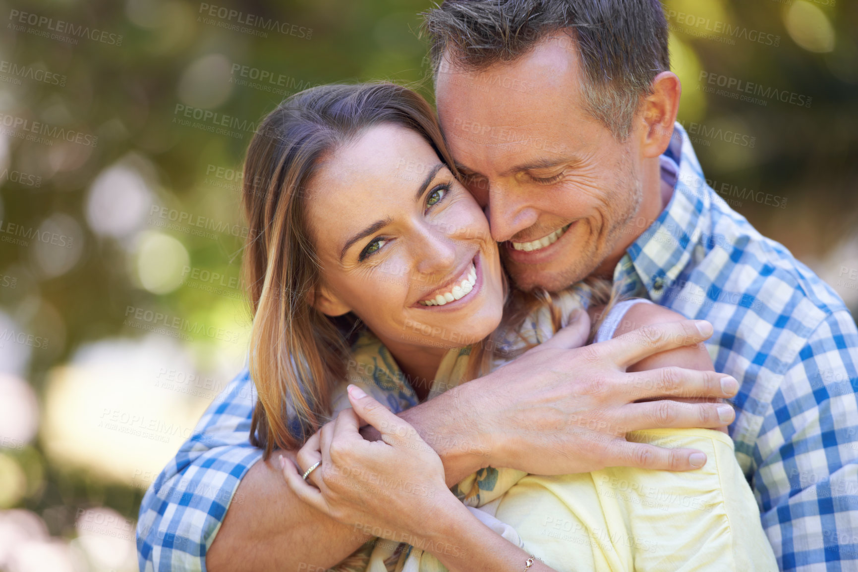 Buy stock photo Shot of an affectionate couple enjoying the summer sun