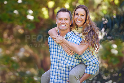 Buy stock photo Mature couple, portrait and woman on piggyback, outside and garden for anniversary. Affectionate, happy and Autumn sun for loving, smile and romantic relationship for Canadian husband and wife