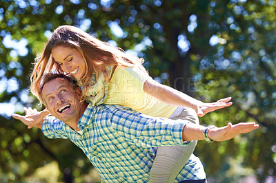 Buy stock photo Smile, piggy back and couple in park for summer romance, trees and playful outdoor date. Love, mature man and happy woman in garden with morning sunshine, games and marriage bonding in nature.
