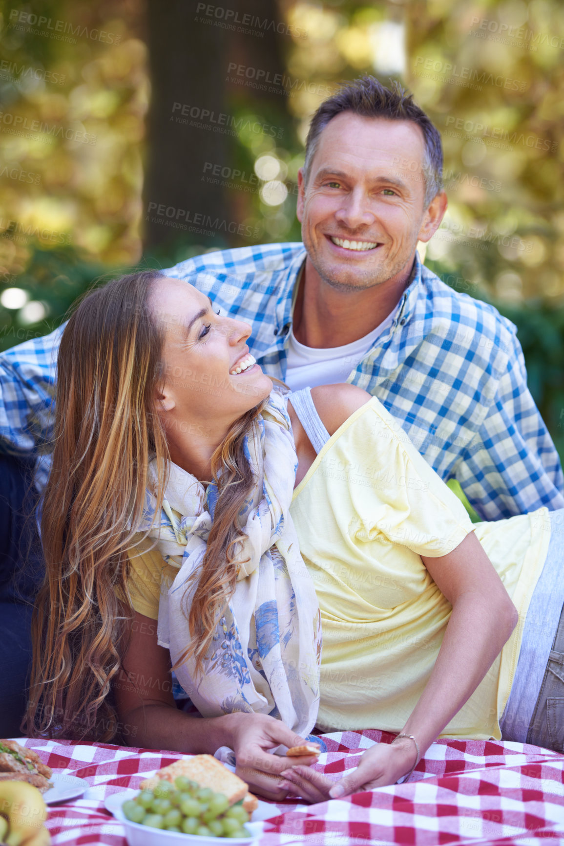 Buy stock photo Mature couple, picnic and bonding in outdoor nature, love and romance in relationship on weekend. Man, portrait and people on date in countryside, smile and adventure in forest or happy on vacation