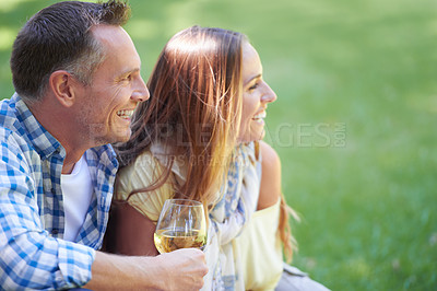 Buy stock photo Couple, picnic and wine glasses for bonding in outdoor nature, love and romance in relationship on weekend. Alcohol, conversation and people in countryside, adventure and grass or happy on vacation